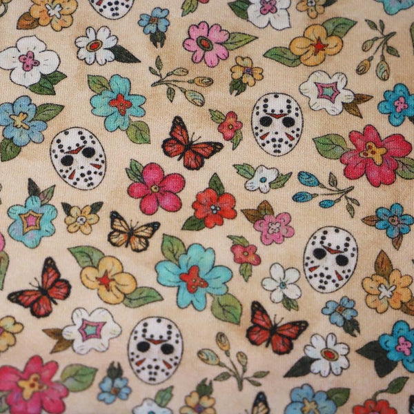 Fabric with  flowers, butterflies, and Jason on a beige background